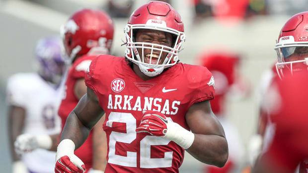 Razorbacks linebacker Brad Spence celebrates an interception for a score against Western Carolina