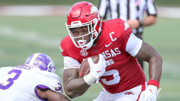 Razorbacks running back Raheim "Rocket" Sanders looks for room in first game of the season