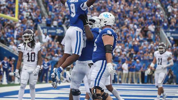 Kentucky Wildcats wide receiver Tayvion Robinson (9) celebrates his touchdown which helped pull the Wildcats even with Eastern Kentucky late in the second quarter Saturday. Sept. 9, 2023.