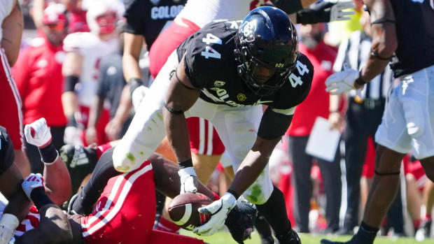 Colorado Buffaloes linebacker Jordan Domineck (44) recovers a fumble against the Nebraska Cornhuskers in the second quarter at Folsom Field