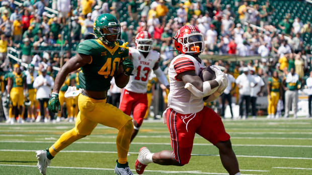 Sep 9, 2023; Waco, Texas, USA; Utah Utes running back Jaylon Glover (1) carries the ball for the game winning past Baylor Bears linebacker Mike Smith Jr. (40) during the second half at McLane Stadium. Mandatory Credit: Raymond Carlin III-USA TODAY Sports  