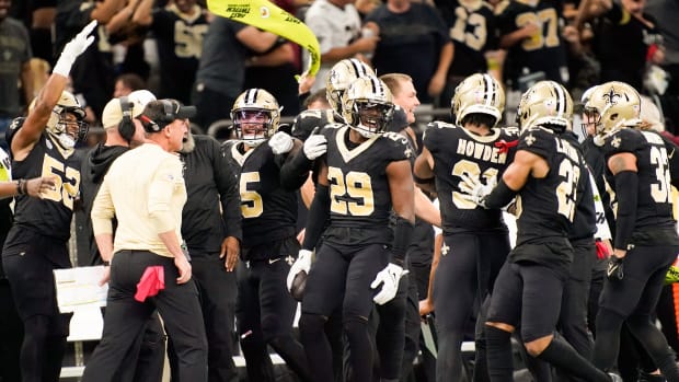 New Orleans Saints cornerback Paulson Adebo (29) celebrates intercepting a Titans pass