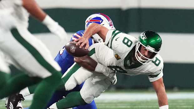 Jets quarterback Aaron Rodgers is sacked by the Bills' Leonard Floyd during the first quarter Monday night. Rodgers torn his Achilles on the play and is out for the season.