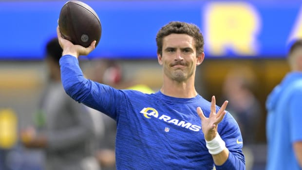 Rams quarterback Stetson Bennett throws a pass during warmups before a game.
