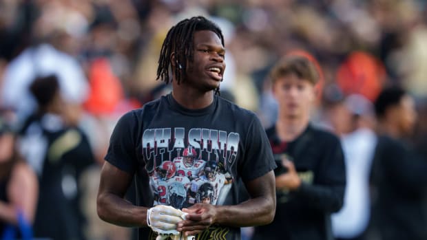Colorado Buffaloes cornerback Travis Hunter (12) warms up prior to the game against the Colorado State Rams at Folsom Field