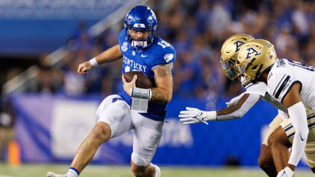 Sep 16, 2023; Lexington, Kentucky, USA; Kentucky Wildcats quarterback Devin Leary (13) carries the ball during the first quarter against the Akron Zips at Kroger Field. Mandatory Credit: Jordan Prather-USA TODAY Sports