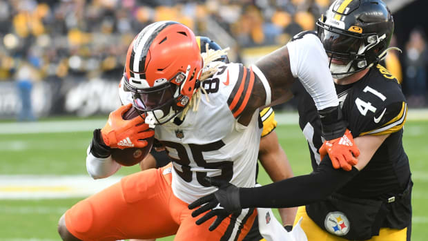 Jan 8, 2023; Pittsburgh, Pennsylvania, USA; Cleveland Browns tight end David Njoku (85) is tackled by Pittsburgh Steelers linebacker Robert Spillane (41) on a seven yard gain during the fourth quarter at Acrisure Stadium. Mandatory Credit: Philip G. Pavely-USA TODAY Sports