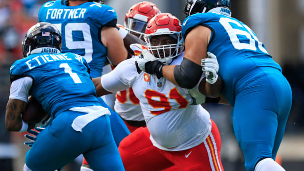 Kansas City Chiefs defensive tackle Derrick Nnadi (91) tries to stop Jacksonville Jaguars running back Travis Etienne Jr. (1) as guard Brandon Scherff (68) pressures during the first quarter of a NFL football game Sunday, Sept. 17, 2023 at EverBank Stadium in Jacksonville, Fla. The Kansas City Chiefs defeated the Jacksonville Jaguars 17-9. [Corey Perrine/Florida Times-Union]  
