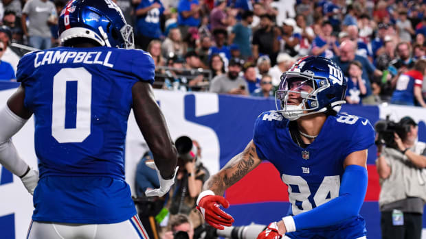 Aug 18, 2023; East Rutherford, New Jersey, USA; New York Giants wide receiver Jalin Hyatt (84) celebrates with New York Giants wide receiver Parris Campbell (0) after catching a touchdown pass against the Carolina Panthers during the second quarter at MetLife Stadium.