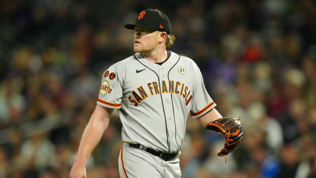 SF Giants ace Logan Webb (62) walks off the field against the Rockies at Coors Field (2023).