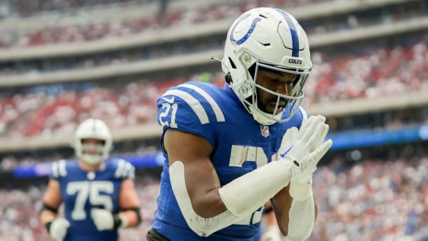 Indianapolis Colts running back Zack Moss (21) bows in the end zone after running in a touchdown Sunday, Sept. 17, 2023, during a game against the Houston Texans at NRG Stadium in Houston