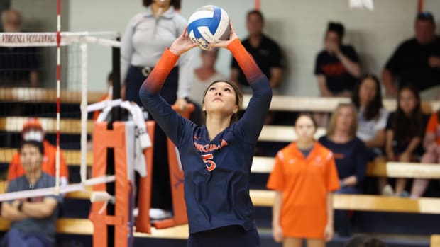 Ashley Le sets the ball during the Virginia volleyball match against Wofford at Memorial Gymnasium.