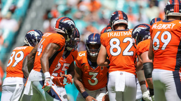Sep 24, 2023; Miami Gardens, Florida, USA; Denver Broncos quarterback Russell Wilson (3) leads a huddle against the Miami Dolphins in the second quarter at Hard Rock Stadium.