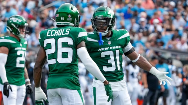 Craig James (31) and Brandin Echols (26) in an NFL Preseason against the Panthers