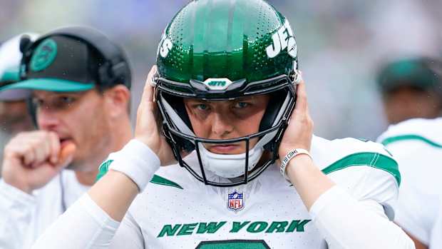 New York Jets quarterback Zach Wilson (2) puts on his helmet before walking onto the field to face the New England Patriots at MetLife Stadium on Sunday, Sept. 24, 2023, in East Rutherford.  