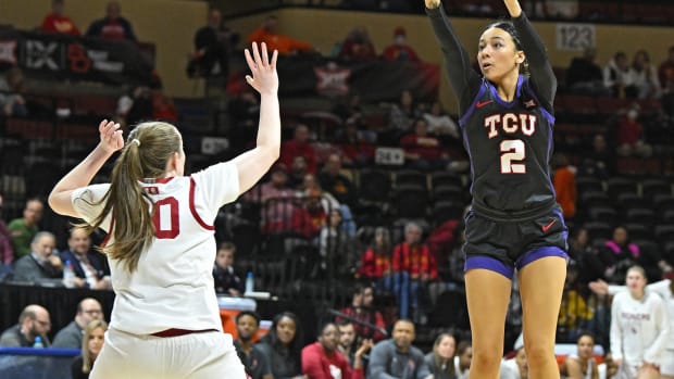 Mar 10, 2023; Kansas City, MO, USA; TCU Horned Frogs guard Tara Manumaleuga (2) shoots the ball against Oklahoma Sooners guard Taylor Robertson (30) during the second half at Municipal Auditorium. Mandatory Credit: Peter Aiken-USA TODAY Sports