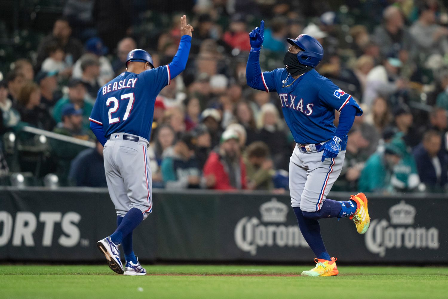 Sep 28, 2023; Seattle, Washington, USA; Texas Rangers right fielder Adolis Garcia (53) is congratulated by third base coach Tony Beasley after hitting a solo home run during the fourth inning against the Seattle Mariners at T-Mobile Park. Mandatory Credit: Stephen Brashear-USA TODAY Sports
