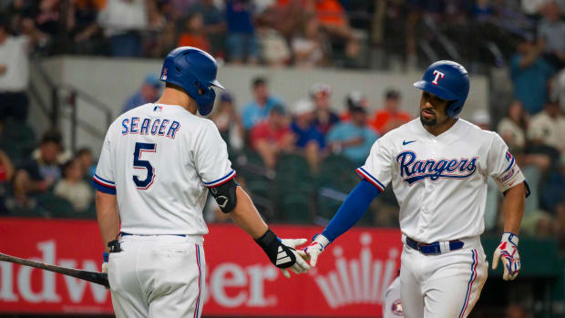 Sep 6, 2023; Arlington, Texas, USA; Texas Rangers shortstop Corey Seager (5) and second baseman Marcus Semien (2) celebrate after Semien hits a home run against the Houston Astros at Globe Life Field. Mandatory Credit: Jerome Miron-USA TODAY Sports