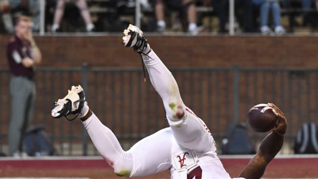 Alabama Crimson Tide quarterback Jalen Milroe (4) rolls over in the end zone after scoring on a long run in Davis Wade Stadium at Mississippi State University.