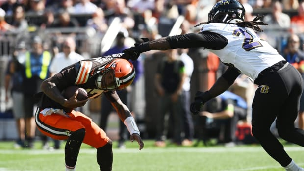Oct 1, 2023; Cleveland, Ohio, USA; Baltimore Ravens linebacker Jadeveon Clowney (24) grabs the jersey of Cleveland Browns quarterback Dorian Thompson-Robinson (17) during the first half at Cleveland Browns Stadium. Mandatory Credit: Ken Blaze-USA TODAY Sports