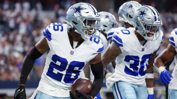Oct 1, 2023; Arlington, Texas, USA; Dallas Cowboys cornerback DaRon Bland (26) celebrates with teammates after returning an interception for a touchdown during the first half against the New England Patriots at AT&T Stadium. Mandatory Credit: Kevin Jairaj-USA TODAY Sports