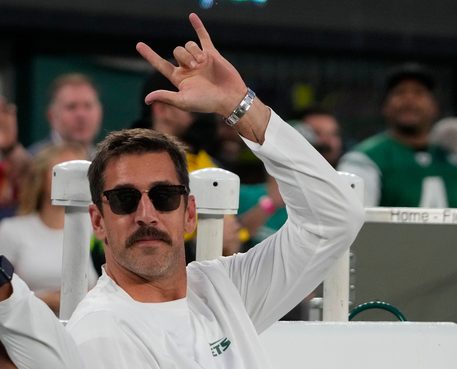 Jets' QB Aaron Rodgers returns to MetLife Stadium on crutches after Achilles surgery