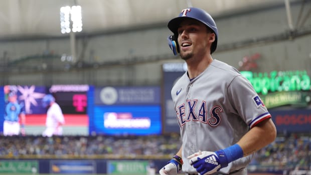 Oct 4, 2023; St. Petersburg, Florida, USA; Texas Rangers left fielder Evan Carter (32) jogs back to the dugout after hitting a solo home run against the Tampa Bay Rays in the fourth inning during game two of the Wildcard series for the 2023 MLB playoffs at Tropicana Field. Mandatory Credit: Nathan Ray Seebeck-USA TODAY Sports