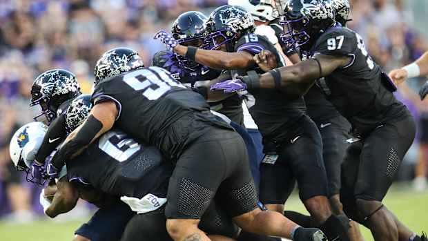 KF TCU WVU 2023 Defense Dog Pile