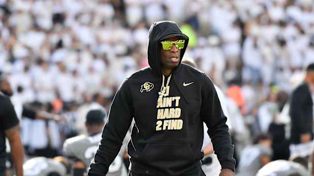 Colorado Buffaloes head coach Deion Sanders walks the field during game agains the USC Trojans at Folsom Field