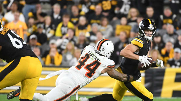 Sep 18, 2023; Pittsburgh, Pennsylvania, USA; Pittsburgh Steelers quarterback Kenny Pickett (8) is chased by Cleveland Browns linebacker Sione Takitaki (44) during the fourth quarter at Acrisure Stadium.
