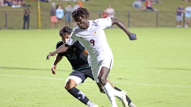 Stephen Annor moves the ball into the box during the Virginia men's soccer game against George Mason at Klockner Stadium.