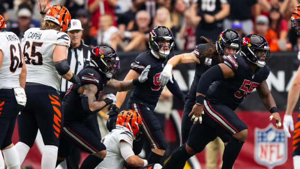 Arizona Cardinals defensive tackle Dante Stills (55) celebrates after sacking Cincinnati Bengals quarterback Joe Burrow in the first half at State Farm Stadium.