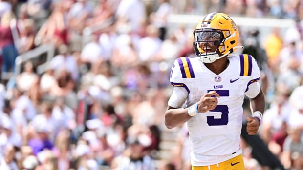 Sep 16, 2023; Starkville, Mississippi, USA; LSU Tigers quarterback Jayden Daniels (5) reacts after a play against the Mississippi State Bulldogs during the second half at Davis Wade Stadium at Scott Field. Mandatory Credit: Matt Bush-USA TODAY Sports  
