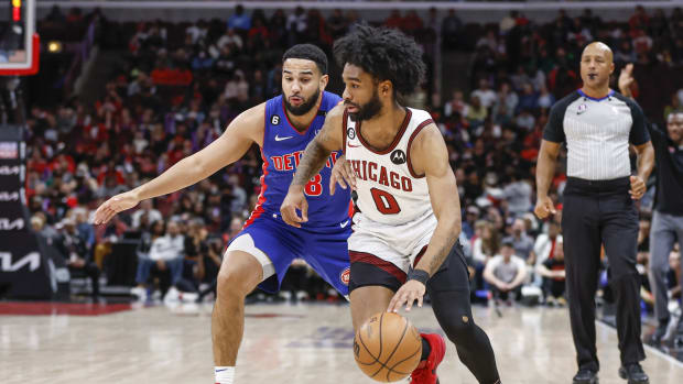 Chicago Bulls guard Coby White (0) drives to the basket against Detroit Pistons guard Cory Joseph (18)