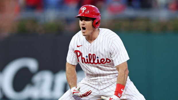 Oct 11, 2023; Philadelphia, Pennsylvania, USA; Philadelphia Phillies catcher J.T. Realmuto (10) celebrates after hitting a two RBI double during the third inning against the Atlanta Braves in game three of the NLDS for the 2023 MLB playoffs at Citizens Bank Park.