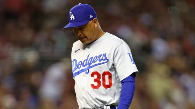 Oct 11, 2023; Phoenix, Arizona, USA; Los Angeles Dodgers manager Dave Roberts (30) during the fifth inning for game three of the NLDS for the 2023 MLB playoffs against the Arizona Diamondbacks at Chase Field. Mandatory Credit: Mark J. Rebilas-USA TODAY Sports
