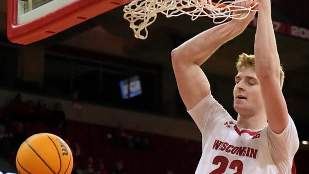 March 14, 2023; Madison, Wisconsin, USA; Wisconsin Badgers forward Steven Crowl (22) dunks during the second half of their opening round game of the National Invitation Tournament against the Bradley Braves at the Kohl Center. Wisconsin beat Bradley 81-62. Mandatory Credit: Mark Hoffman - USA Today Sports