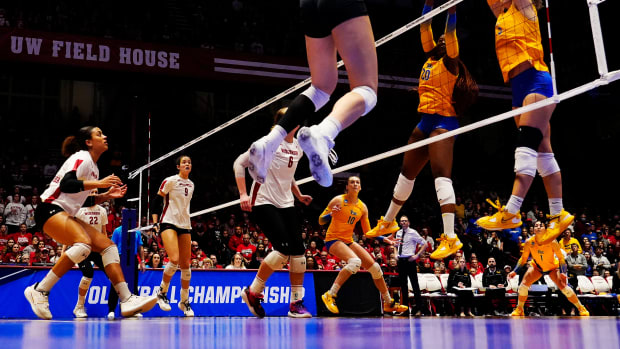 Wisconsin right side Anna Smrek (14) spikes the the ball during the fifth set of their regional final match against Pittsburgh at the Wisconsin Field House on Saturday December 10, 2022 in Madison, Wis.