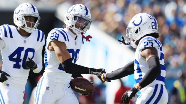 Indianapolis Colts cornerback JuJu Brents (29) is congratulated by cornerback Kenny Moore II (23) after picking off Jacksonville Jaguars quarterback Trevor Lawrence (16), not shown, during the fourth quarter of an NFL football matchup Sunday, Oct. 15, 2023 at EverBank Stadium in Jacksonville, Fla. The Jacksonville Jaguars defeated the Indianapolis Colts 37-20. [Corey Perrine/Florida Times-Union]