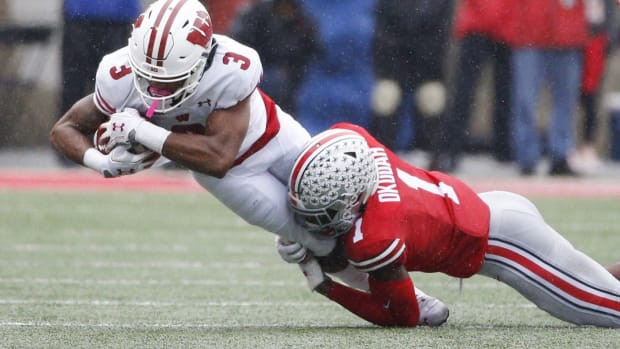 Ohio State Buckeyes cornerback Jeff Okudah (1) tackles Wisconsin Badgers wide receiver Kendric Pryor (3) during the first quarter of a NCAA Division I college football game between the Ohio State Buckeyes and the Wisconsin Badgers on Saturday, October 26, 2019 at Ohio Stadium in Columbus, Ohio. [Joshua A. Bickel/Dispatch] Osu19wis Jb 30