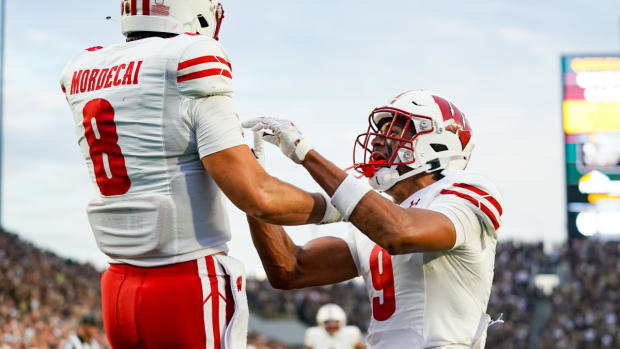 Sep 22, 2023; West Lafayette, Indiana, USA; Wisconsin Badgers quarterback Tanner Mordecai (8) celebrates with Wisconsin Badgers wide receiver Bryson Green (9) after running for a touchdown during the first half at Ross-Ade Stadium. Mandatory Credit: Robert Goddin-USA TODAY Sports