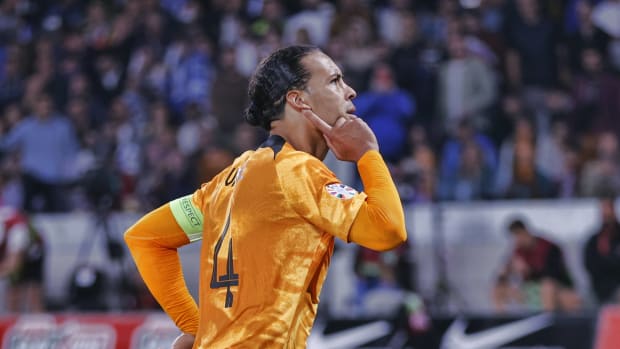 Virgil van Dijk pictured celebrating after scoring a late penalty kick for the Netherlands in a 1-0 win over Greece in October 2023