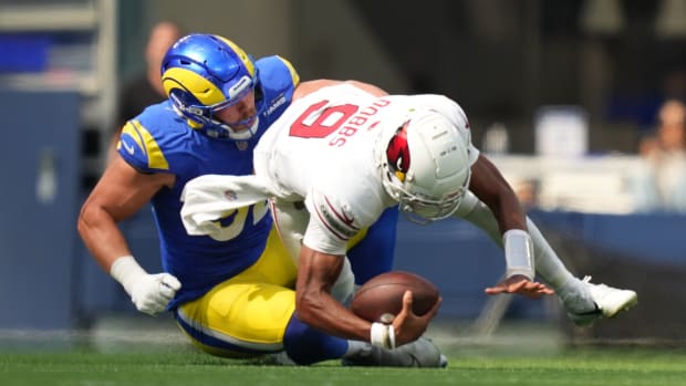 October 15, 2023; Inglewood, California, USA; Los Angeles Rams defensive end Jonah Williams (92) sacks Arizona Cardinals quarterback Joshua Dobbs (9) during the first quarter at SoFi Stadium. Mandatory Credit: Kyle Terada-USA TODAY Sports