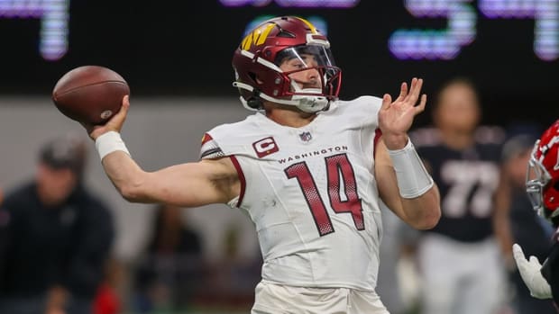 Oct 15, 2023; Atlanta, Georgia, USA; Washington Commanders quarterback Sam Howell (14) throws a pass against the Atlanta Falcons in the first quarter at Mercedes-Benz Stadium.