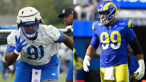 Los Angeles Rams defensive tackles Kobie Turner (91) and Aaron Donald (99).