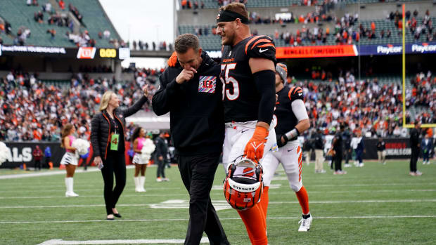 Cincinnati Bengals defensive coordinator Lou Anarumo, left, and Cincinnati Bengals linebacker Logan Wilson (55), walk off the field together at the conclusion of an NFL football game between the Seattle Seahawks and the Cincinnati Bengals Sunday, Oct. 15, 2023, at Paycor Stadium in Cincinnati. The Cincinnati Bengals won, 17-13.