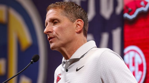 Razorbacks coach Eric Musselman at the podium for SEC Media Day on Wednesday