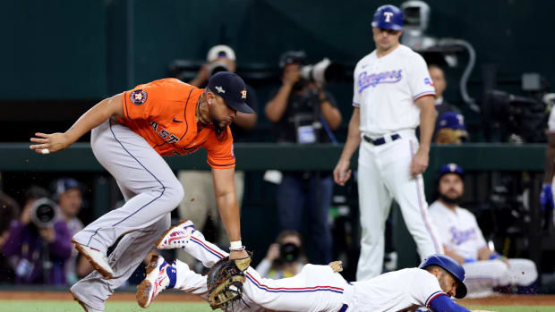 Houston Astros first baseman Jose Abreu tags out Texas Rangers second baseman Marcus Semien for a double play in the fifth inning of Game 4 of the ALCS  Thursday night at Globe Life Field.