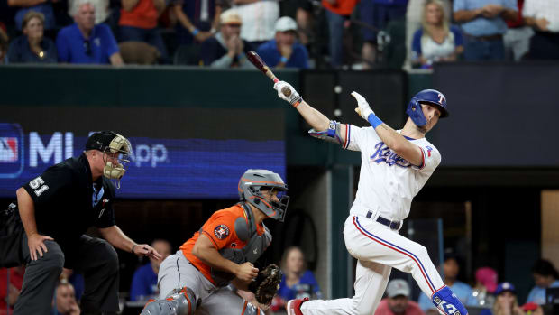 Oct 20, 2023; Arlington, Texas, USA; Texas Rangers center fielder Evan Carter (32) strikes out to end game five in the ALCS against the Houston Astros for the 2023 MLB playoffs at Globe Life Field. Mandatory Credit: Kevin Jairaj-USA TODAY Sports