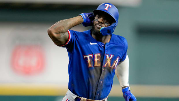Adolis Garcia taunts the crowd after a home run